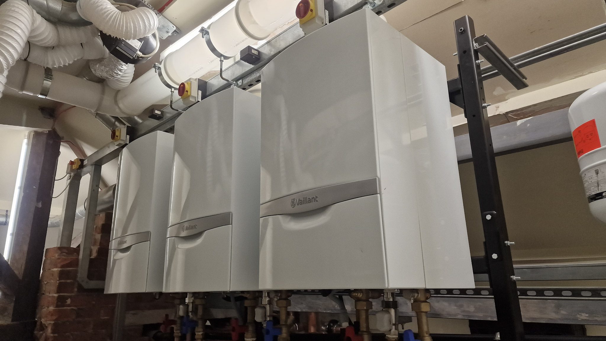 Three Vaillant commercial boilers fitted in a plant room